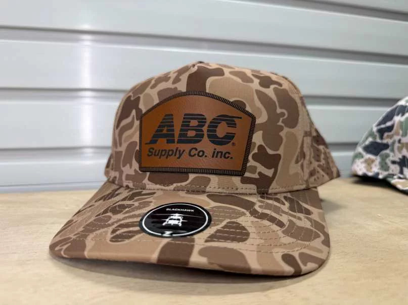 Old school camo hat with a rawhide ABC Supply patch