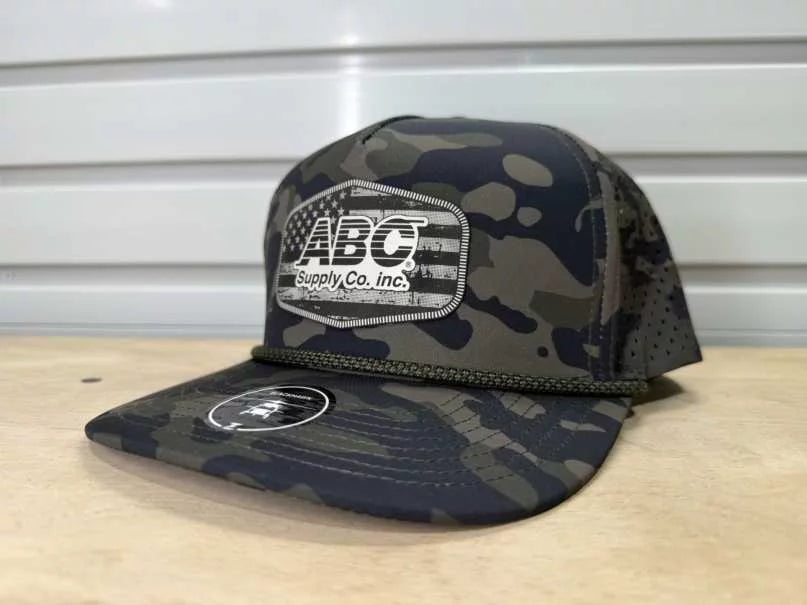 Olive camo rope hat with a white distressed flag ABC Supply patch