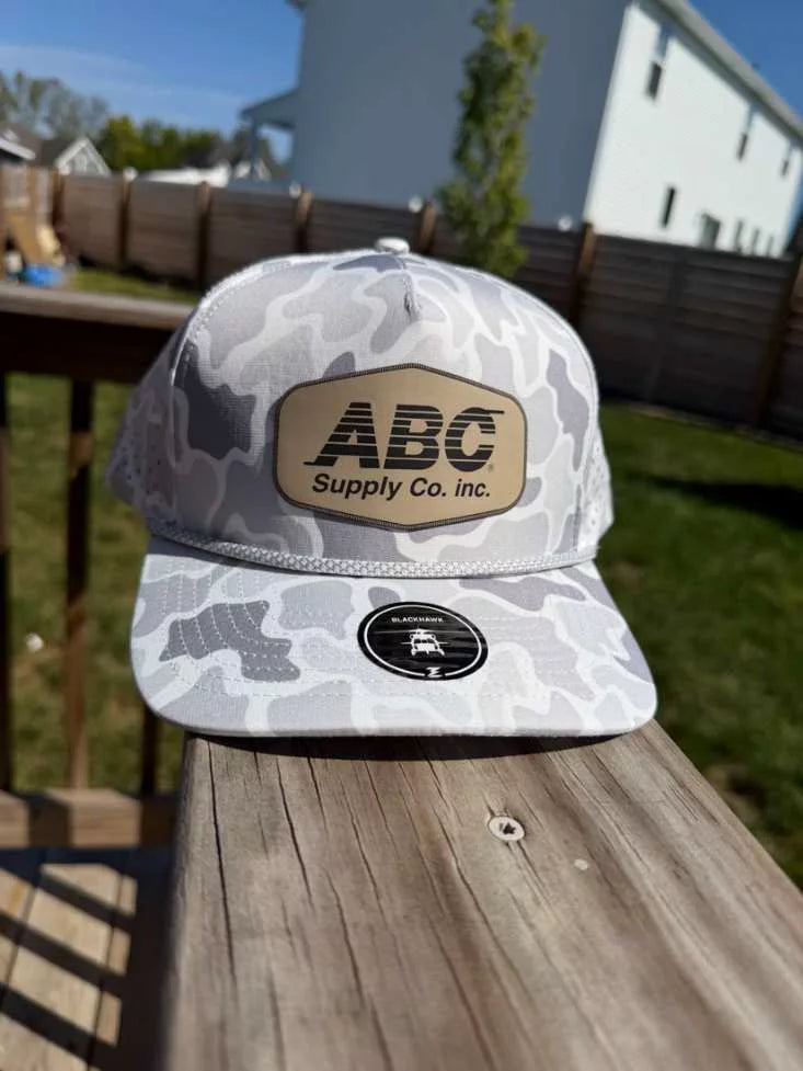 Snow camo rope hat with a sand ABC Supply patch