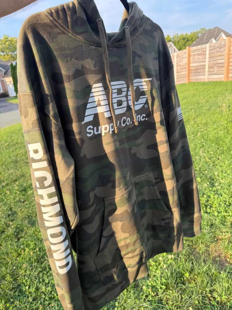 Camo hoodie with a large printed ABC Supply chest logo and RICHMOND printed down the sleeve